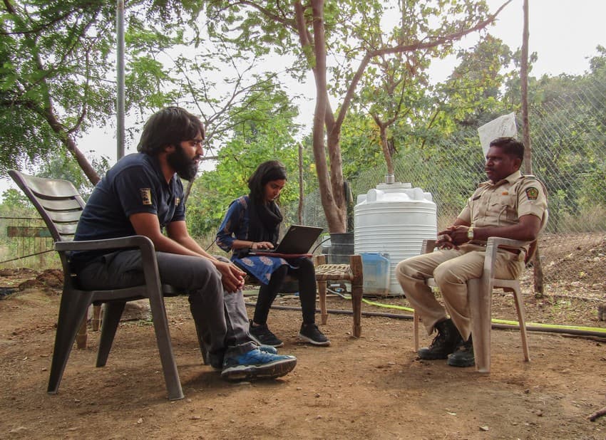 WCT social scientists engage in an interview with a forest guard in Melghat Tiger Reserve, at one of the Anti-poaching Camps.