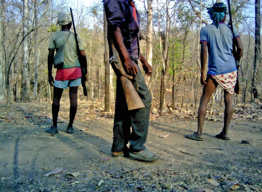 Photos of people toting guns), obviously for hunting wild animals, though not as common, was more frequently captured than one can imagine, indicating heavy anthropogenic pressure on corridors.