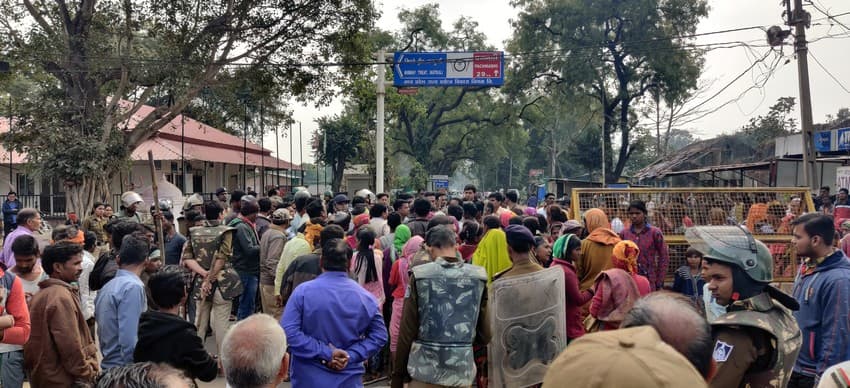 Joint staff of police and Forest Department managing the crowd that has gathered post an unfortunate human casualty caused as result of human-tiger conflict in Madhya Pradesh.