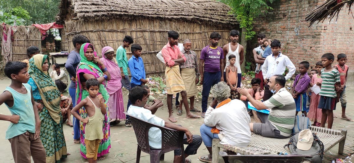 Dr. Nachiket Kelkar interacting with villagers in Bihar.