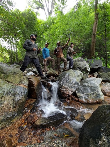 WCT research team monitoring a released pangolin in the field.