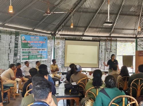 Mridula Vijairaghavan addresses the participants at the Cauvery Wildlife Sanctuary in the presence of senior forest officers and other staff