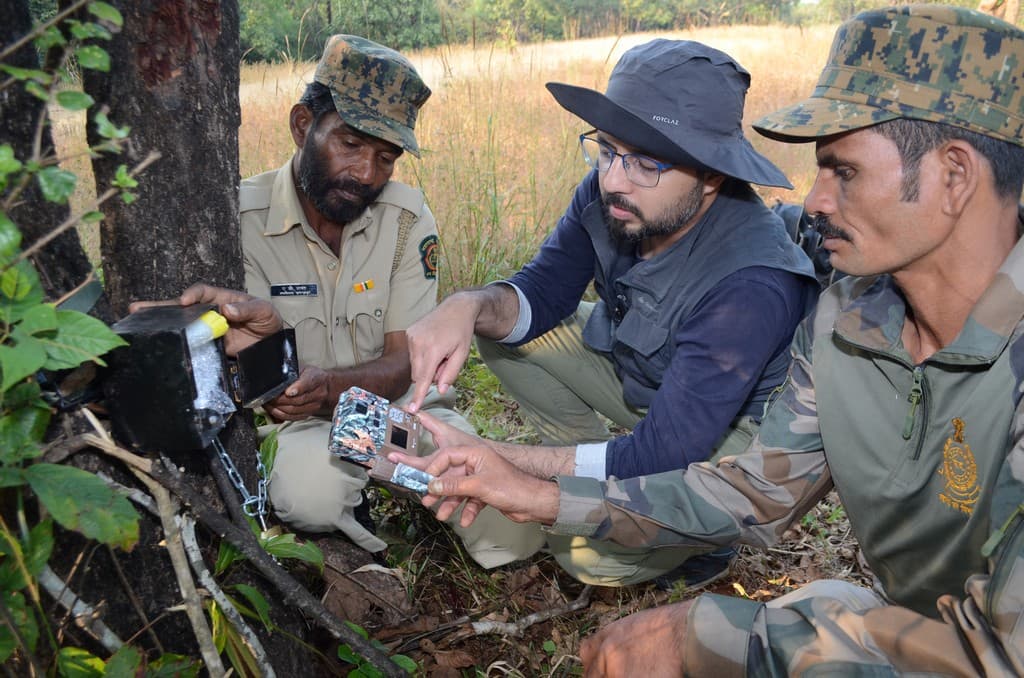 Girish Punjabi installs camera traps along with the forest staff in Tillari Conservation Reserve.