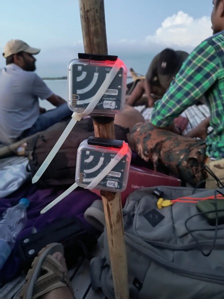 Hydromoths being deployed in a river to detect and record ultrasonic soundwaves produced by the dolphins. ©Vedant Barje/WCT